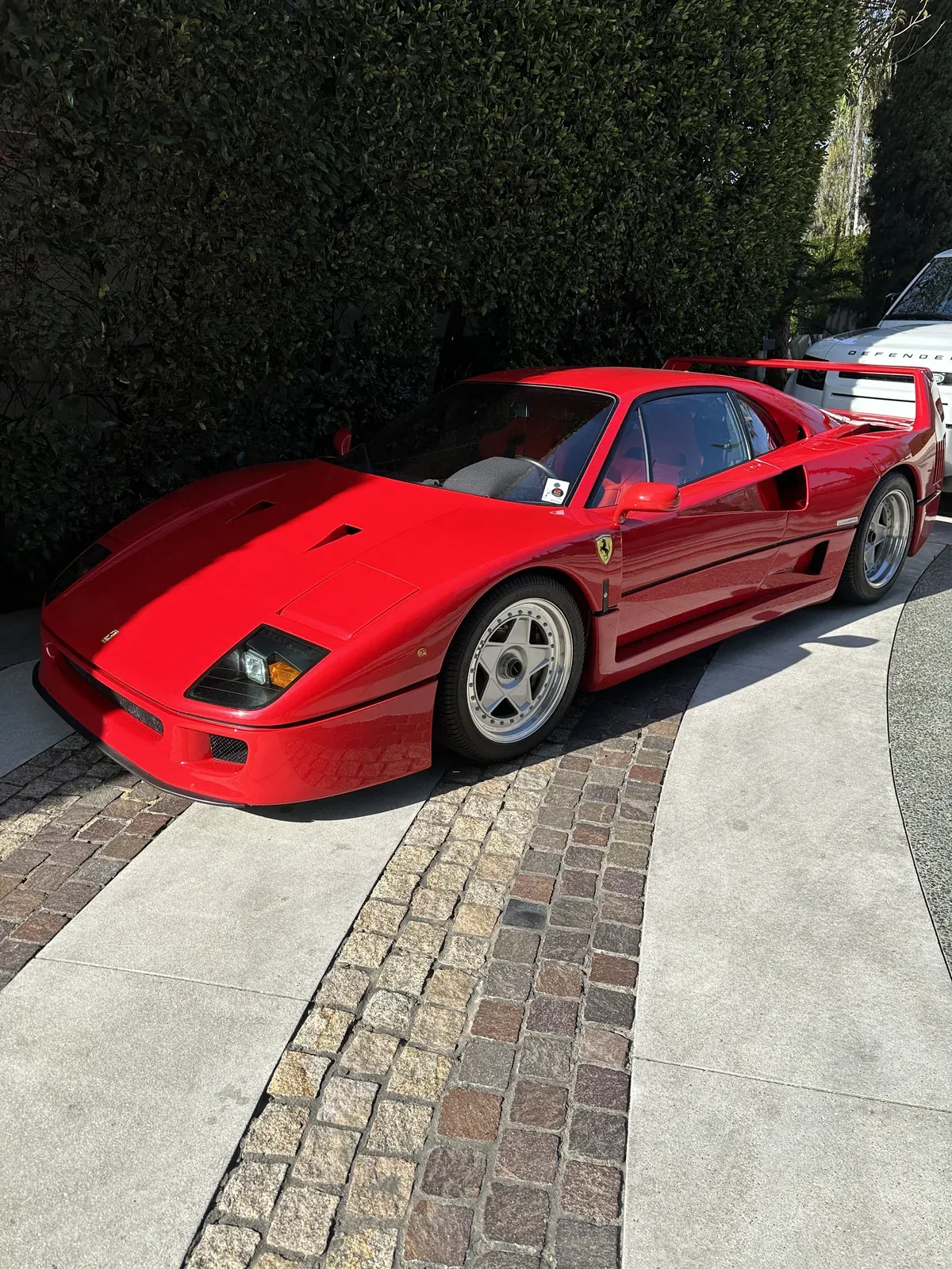 Red Ferrari F40 front three-quarter view with glossy detailed paint