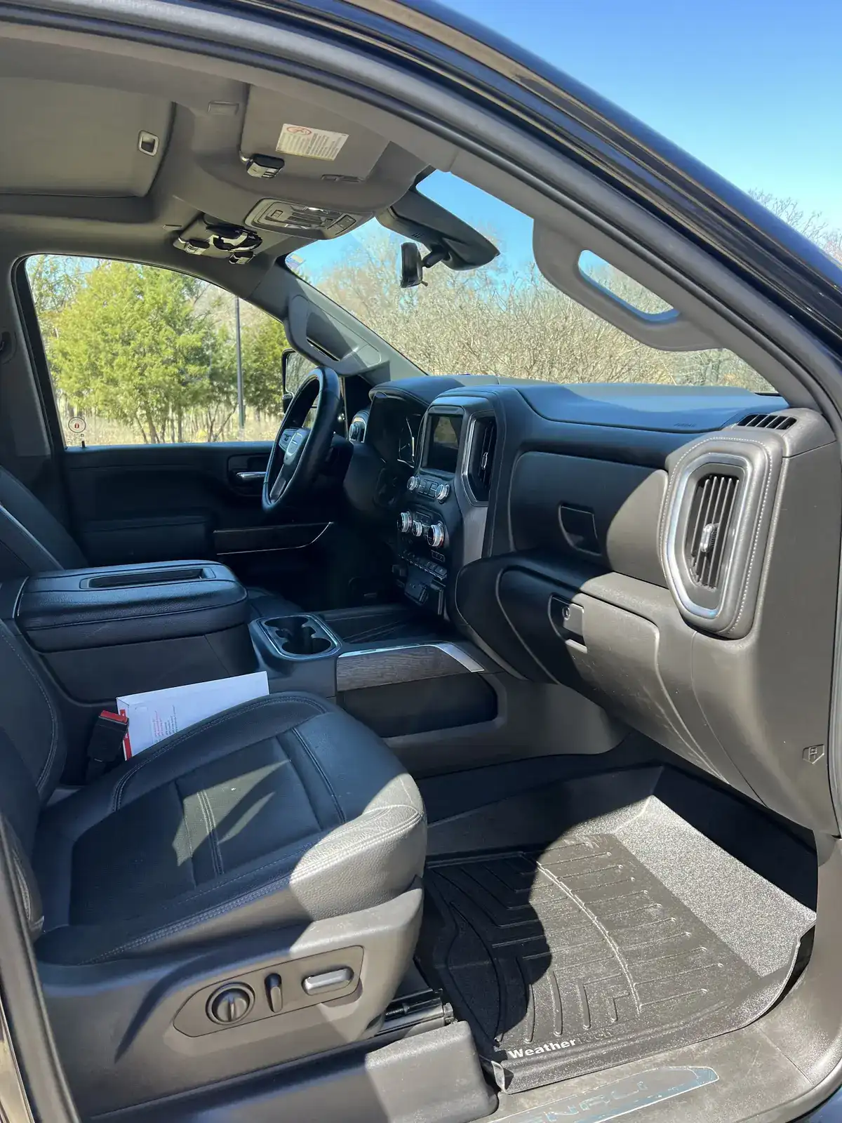 Interior car detailing in a Kaufman, TX driveway